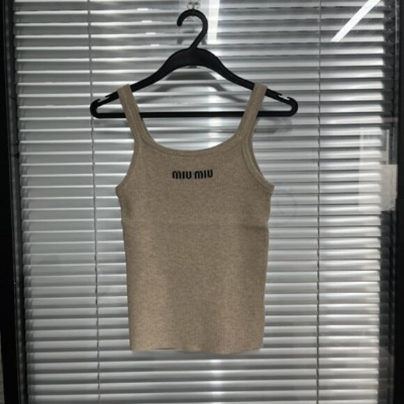 The letter logo on the chest of the Miu Miu khaki halter vest